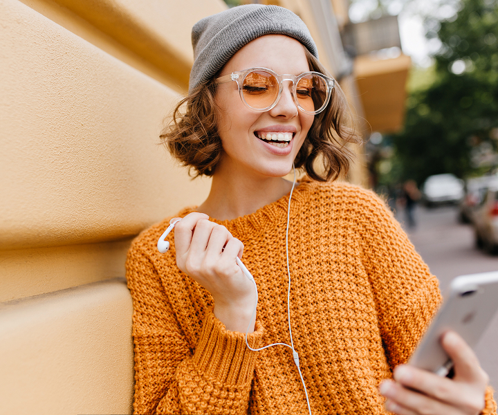 smiling girl looking at the phone